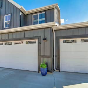 grey house with double attached extended garage